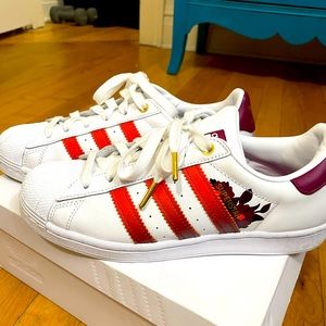 Adidas all star shoes with Maroon floral pattern.